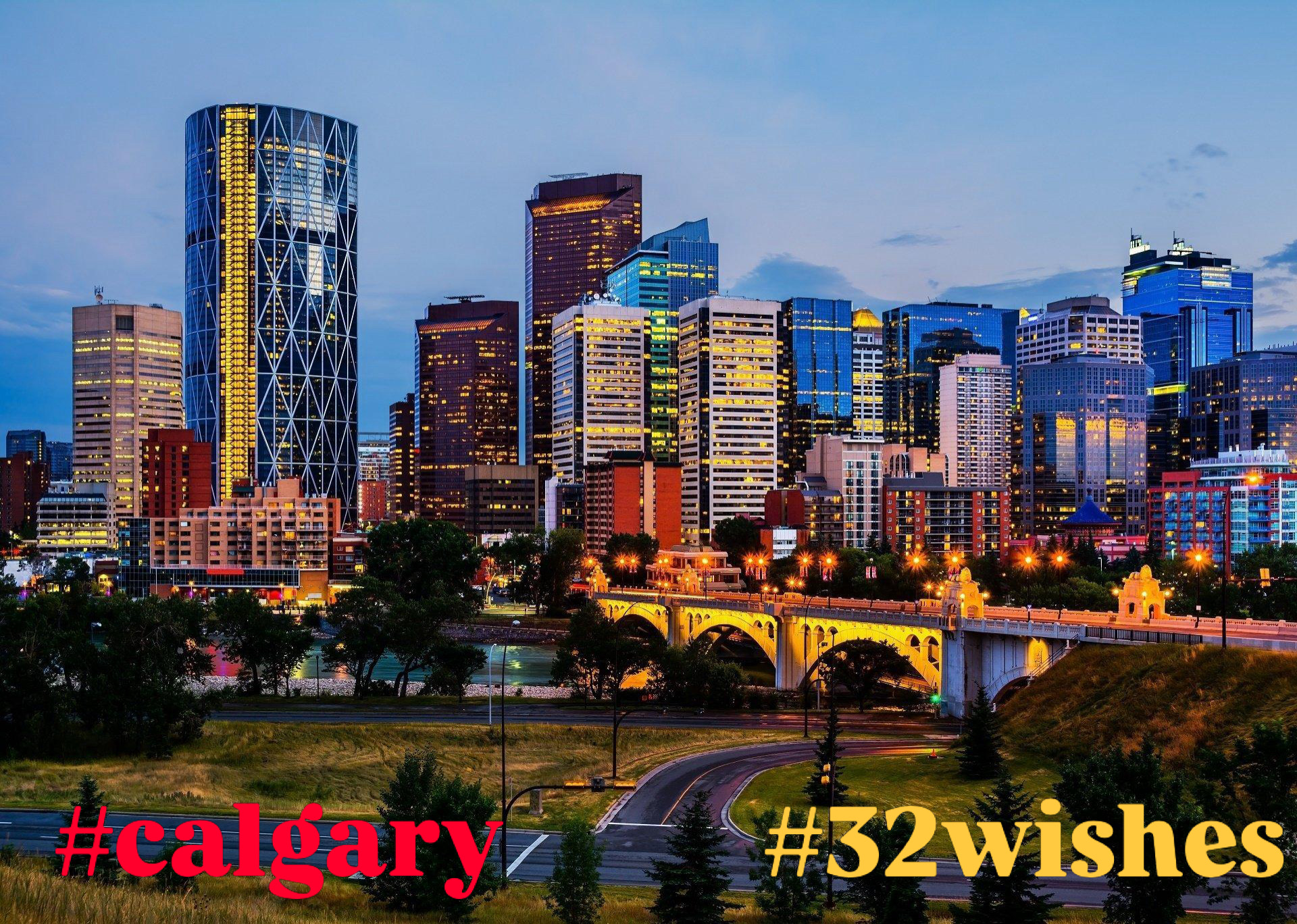 Calgary skyline and illuminated bridge at dusk, labeled #calgary #32wishes