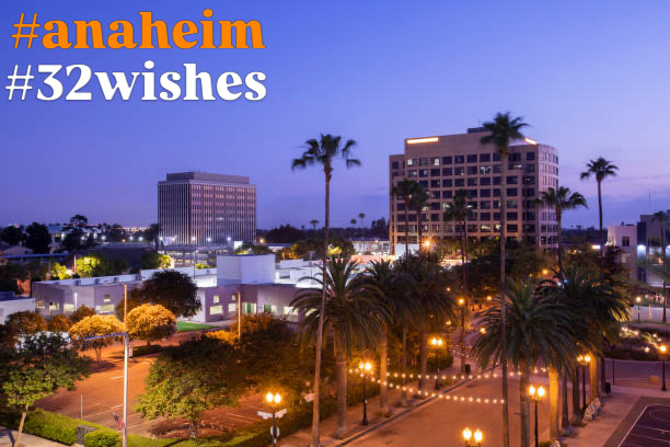Anaheim at dusk with palm trees and illuminated streets, labeled #anaheim #32wishes